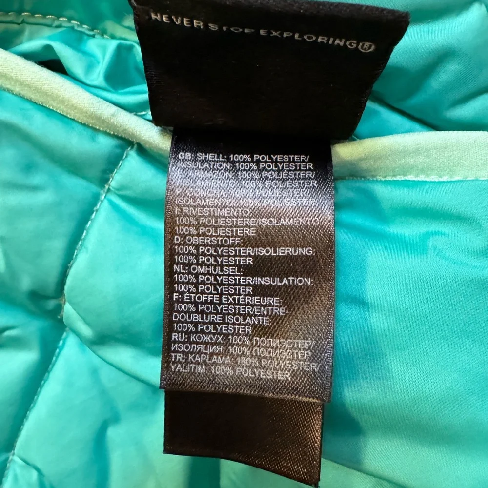 The North Face reversible puffers jacket.  Green, yellow, white swirl. Girls XL